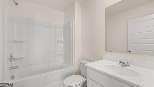 1139 Blue Juniper Cir, Loganville, GA 30052 - bathroom with toilet, vanity, and shower / bathtub combination