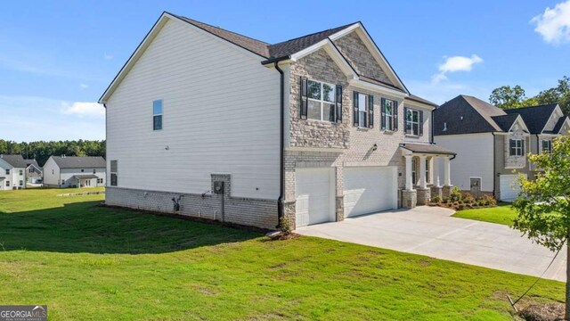 1139 Blue Juniper Cir, Loganville, GA 30052 - view of side of property featuring a residential view, driveway, stone siding, an attached garage, and a lawn