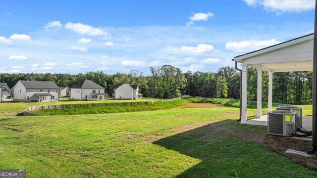 1139 Blue Juniper Cir, Loganville, GA 30052 - view of yard featuring central air condition unit