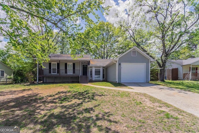 single story home with fence, a garage, a front yard, and driveway