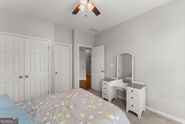 6058 Grand Reunion Dr, Hoschton, GA 30548 - carpeted bedroom featuring visible vents, baseboards, and ceiling fan