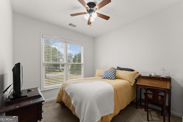 6058 Grand Reunion Dr, Hoschton, GA 30548 - carpeted bedroom with visible vents, baseboards, and a ceiling fan