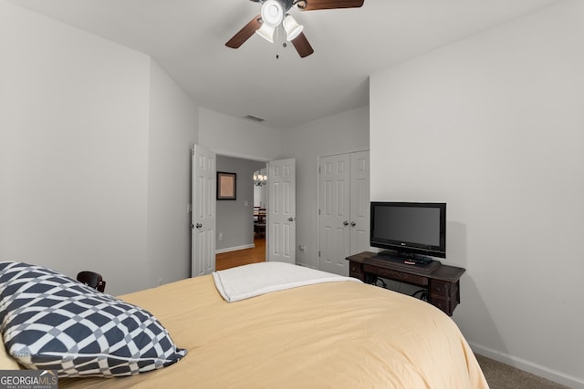 6058 Grand Reunion Dr, Hoschton, GA 30548 - carpeted bedroom featuring visible vents, a closet, baseboards, and a ceiling fan