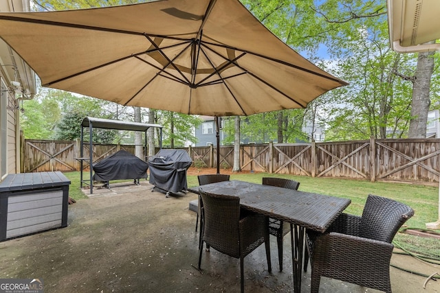 6058 Grand Reunion Dr, Hoschton, GA 30548 - view of patio / terrace with outdoor dining space, grilling area, a fenced backyard, and a gate