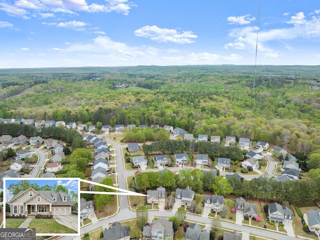 6058 Grand Reunion Dr, Hoschton, GA 30548 - birds eye view of property featuring a view of trees and a residential view