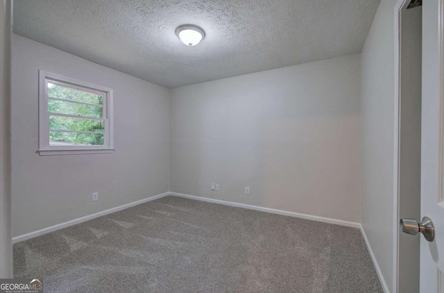 3647 Miller St, Lithia Springs, GA 30122 - carpeted empty room with a textured ceiling and baseboards