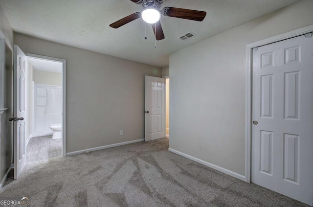 3647 Miller St, Lithia Springs, GA 30122 - unfurnished bedroom featuring carpet flooring, baseboards, ensuite bath, and a ceiling fan