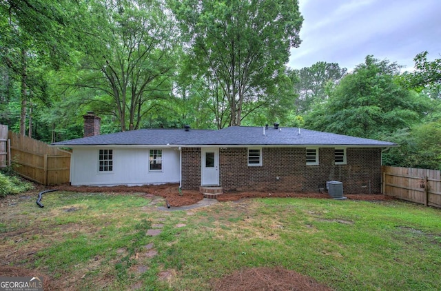 3647 Miller St, Lithia Springs, GA 30122 - rear view of property with a chimney, cooling unit, and brick siding