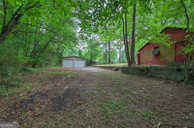 3647 Miller St, Lithia Springs, GA 30122 - view of yard featuring an outbuilding, a garage, and a wall mounted AC