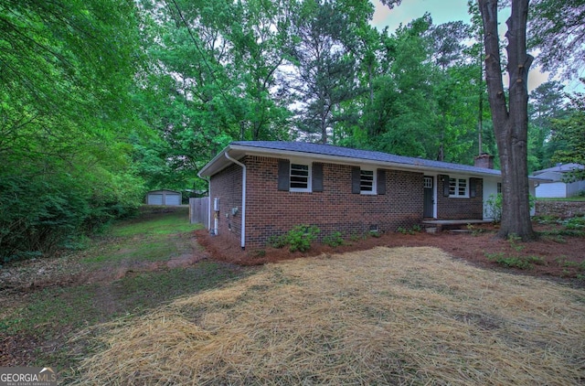 3647 Miller St, Lithia Springs, GA 30122 - view of front of house featuring brick siding and a chimney