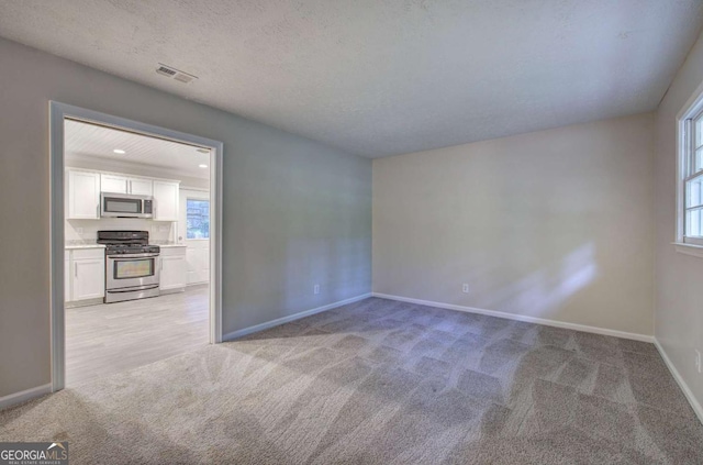 3647 Miller St, Lithia Springs, GA 30122 - unfurnished room with light colored carpet and baseboards