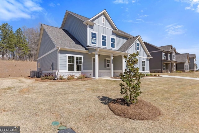 craftsman-style house featuring a porch, board and batten siding, and central AC unit
