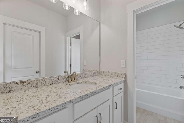 full bathroom featuring shower / tub combination and vanity