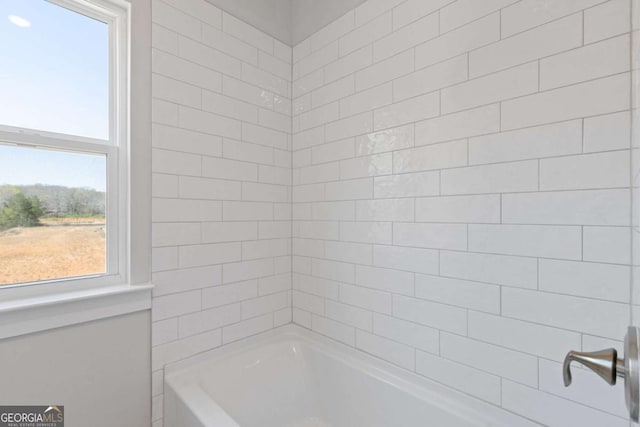 bathroom with shower / tub combination