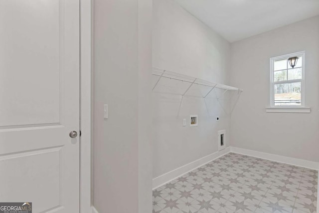 laundry area featuring hookup for an electric dryer, baseboards, laundry area, hookup for a washing machine, and light floors
