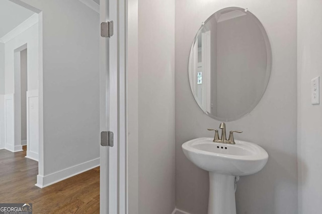 bathroom featuring baseboards and wood finished floors