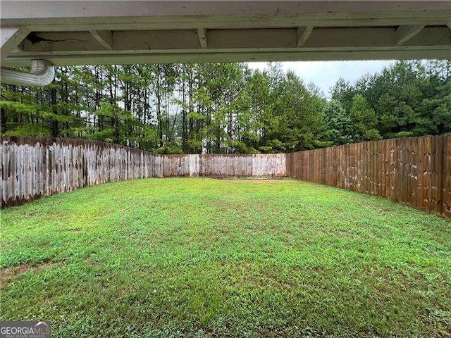 view of yard featuring a fenced backyard