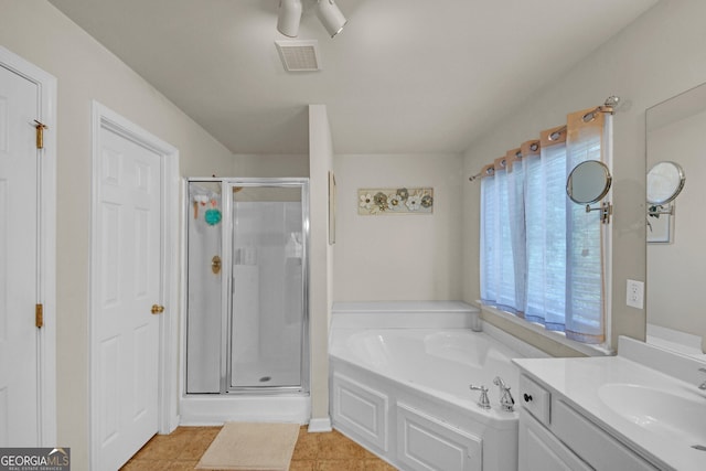 full bath featuring a garden tub, a shower stall, vanity, visible vents, and tile patterned floors