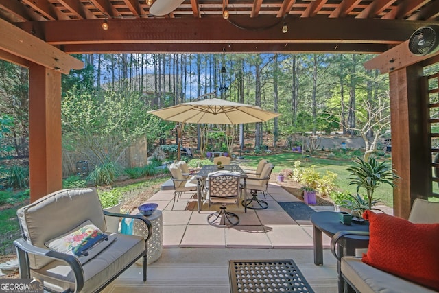 view of patio featuring an outdoor living space and outdoor dining area