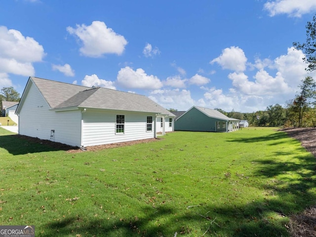 back of house with a yard