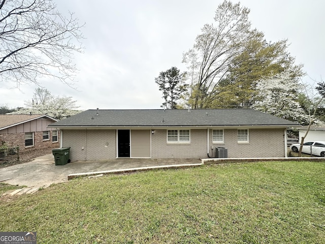 3539 Meadowridge Dr SW, Atlanta, GA 30331 - back of house featuring a patio, brick siding, central AC unit, and a lawn