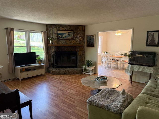 3013 Barcelona Way, Conyers, GA 30012 - living room with wood finished floors, a textured ceiling, and stairway