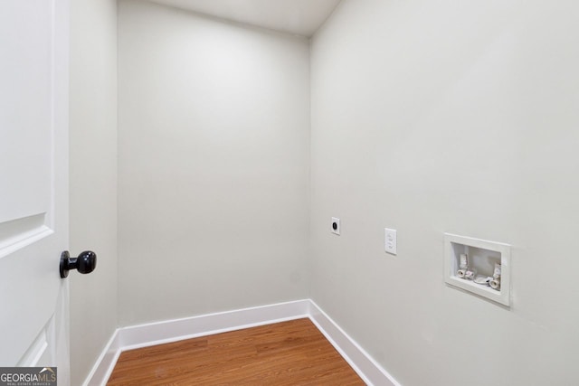 washroom with laundry area, wood finished floors, hookup for an electric dryer, washer hookup, and baseboards
