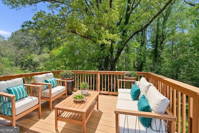 wooden deck with an outdoor living space