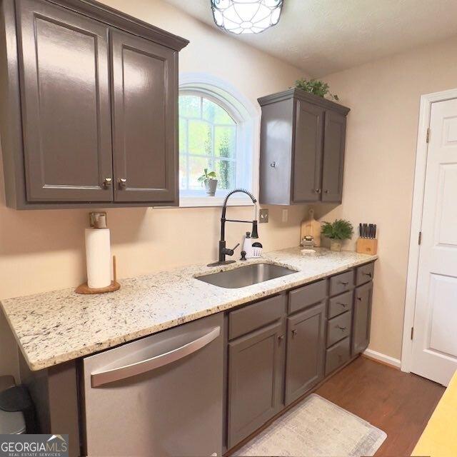 33 Mountain View Dr, Rockmart, GA 30153 - kitchen with dishwasher, gray cabinets, dark wood finished floors, and light stone countertops