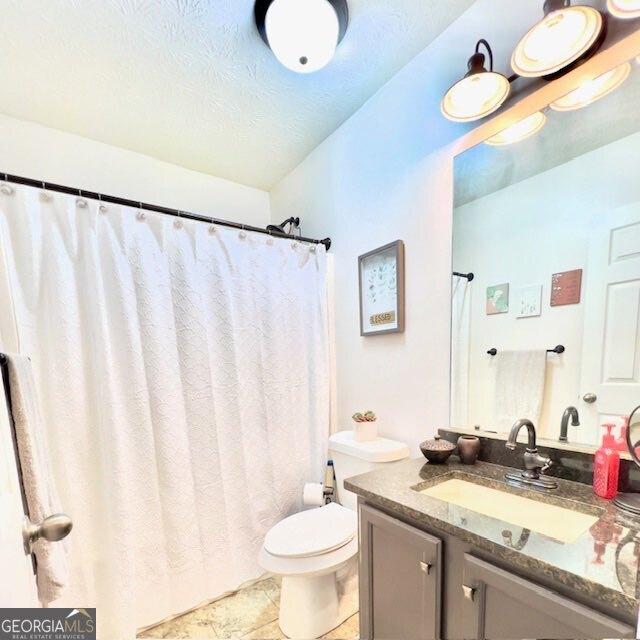 33 Mountain View Dr, Rockmart, GA 30153 - bathroom featuring vanity, a textured ceiling, and a shower with shower curtain