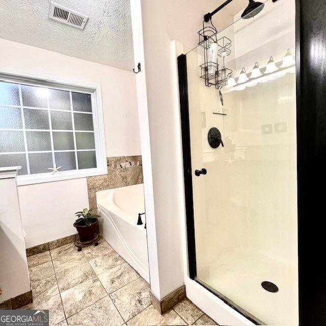 33 Mountain View Dr, Rockmart, GA 30153 - full bathroom with a shower stall, a bath, and tile patterned floors