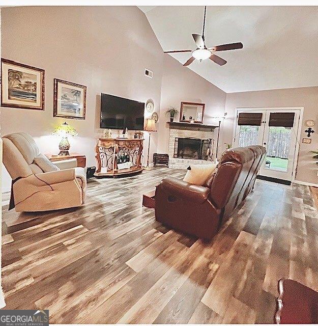 33 Mountain View Dr, Rockmart, GA 30153 - living area featuring ceiling fan, wood finished floors, a fireplace, and high vaulted ceiling