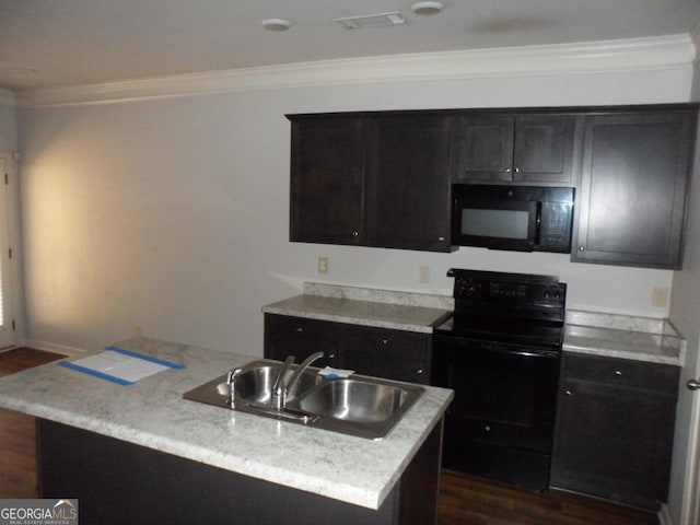 kitchen with a sink, black appliances, crown molding, and dark wood finished floors