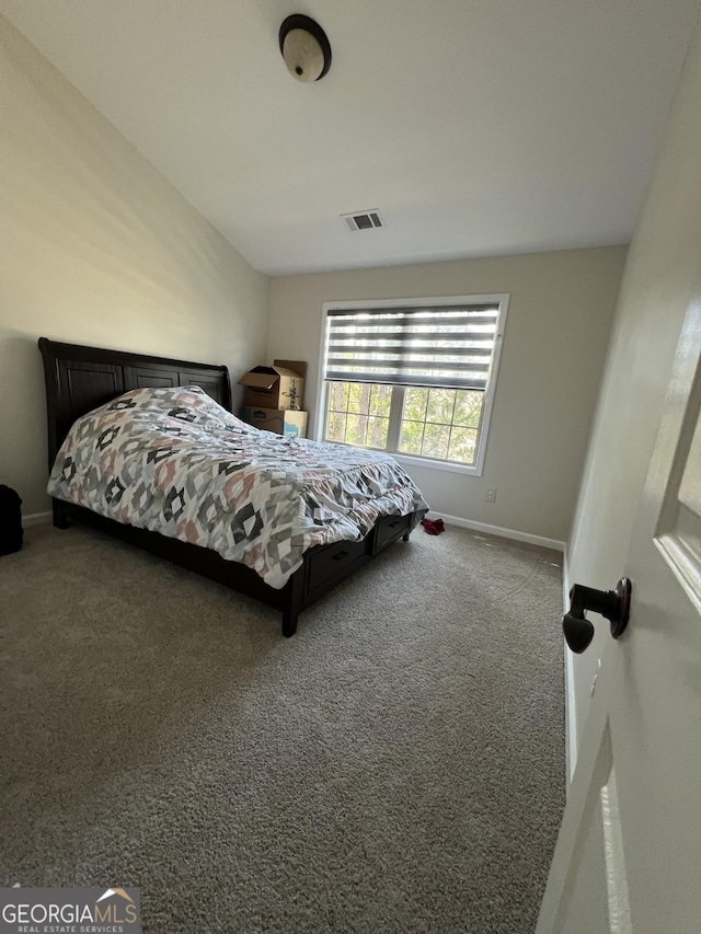 carpeted bedroom with baseboards and visible vents