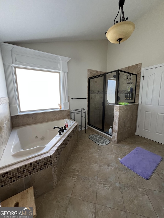full bath with lofted ceiling, a whirlpool tub, and a shower stall