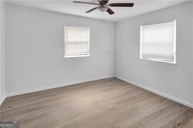 1204 Lakeview Dr NW, Conyers, GA 30012 - spare room with wood finished floors, baseboards, and a ceiling fan