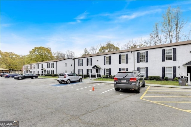 1204 Lakeview Dr NW, Conyers, GA 30012 - view of building exterior featuring a residential view and uncovered parking
