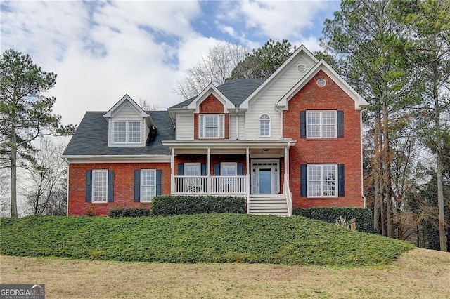8100 Greens Mill Way, Loganville, GA 30052 - view of front facade with brick siding and a porch