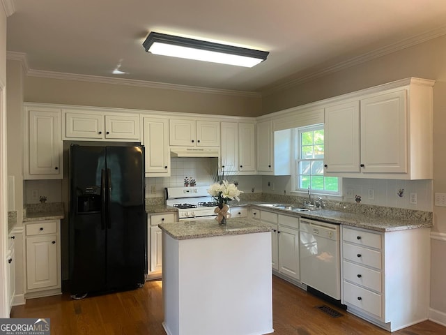 8100 Greens Mill Way, Loganville, GA 30052 - kitchen with white appliances, under cabinet range hood, a sink, dark wood finished floors, and white cabinetry