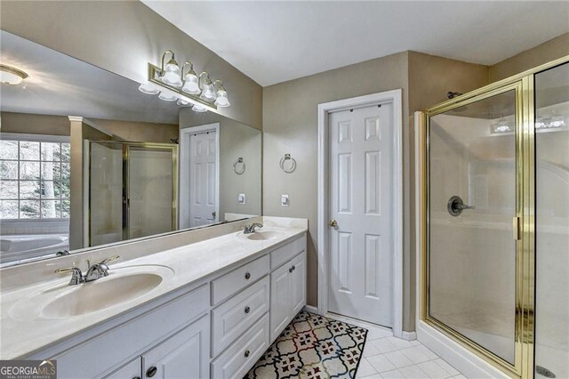 8100 Greens Mill Way, Loganville, GA 30052 - full bath featuring a stall shower, tile patterned floors, and double vanity