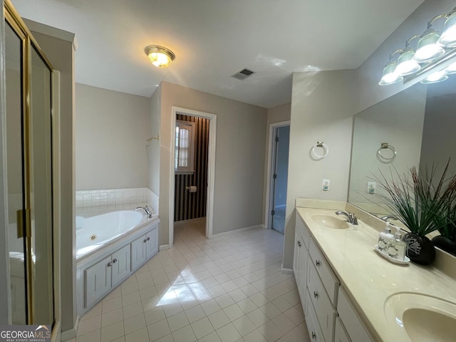 8100 Greens Mill Way, Loganville, GA 30052 - bathroom featuring tile patterned floors, a whirlpool tub, double vanity, and baseboards