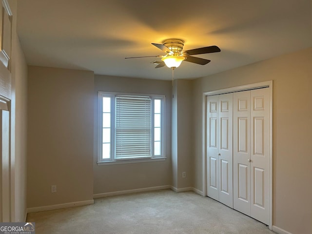 8100 Greens Mill Way, Loganville, GA 30052 - unfurnished bedroom featuring light colored carpet, a closet, and baseboards