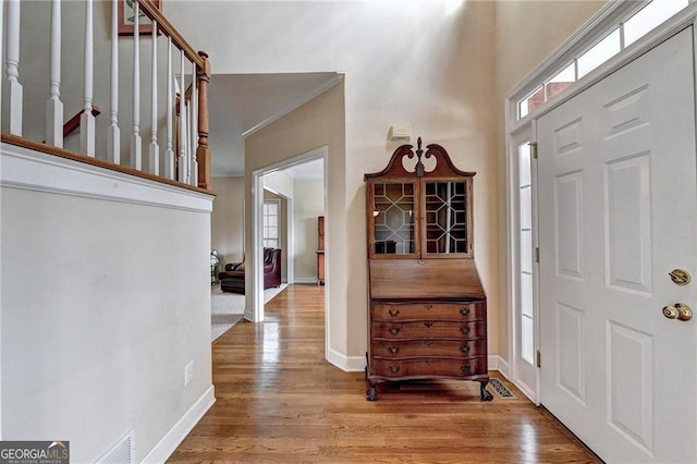 8100 Greens Mill Way, Loganville, GA 30052 - foyer entrance with wood finished floors, healthy amount of natural light, baseboards, and a high ceiling