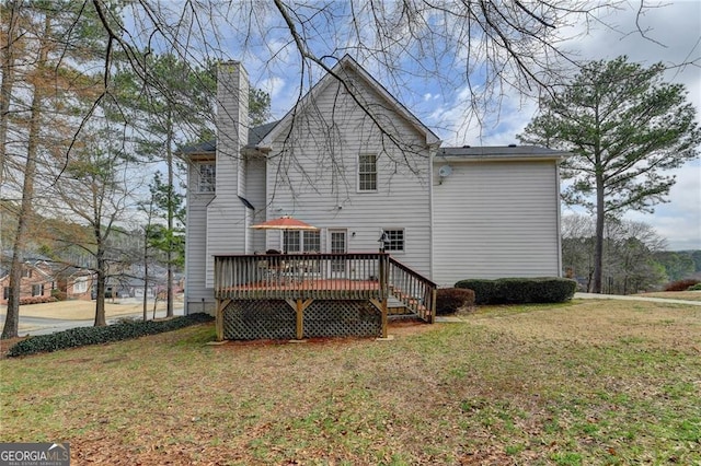 8100 Greens Mill Way, Loganville, GA 30052 - rear view of property with a wooden deck, a chimney, and a lawn