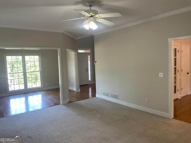 8100 Greens Mill Way, Loganville, GA 30052 - spare room featuring carpet floors, crown molding, baseboards, and a ceiling fan