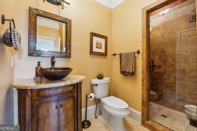 6935 Wakehurst Pl, Cumming, GA 30040 - full bath with toilet, vanity, a stall shower, tile patterned floors, and baseboards