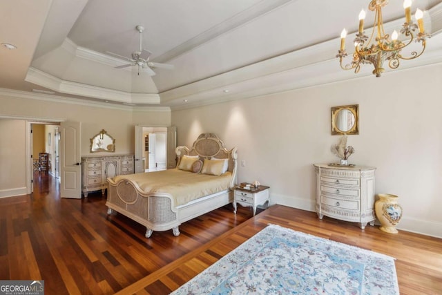 6935 Wakehurst Pl, Cumming, GA 30040 - bedroom featuring a chandelier, wood finished floors, baseboards, ornamental molding, and a tray ceiling