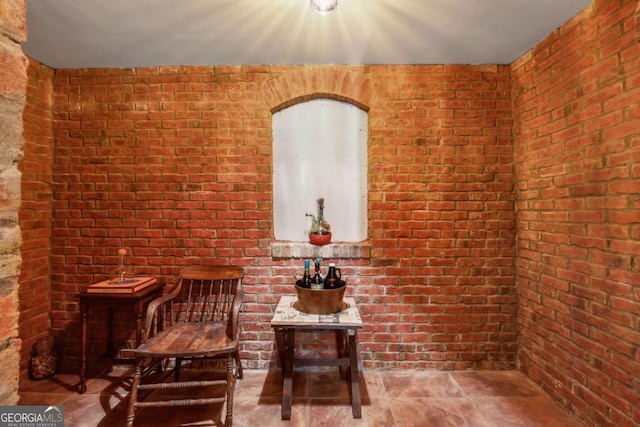 6935 Wakehurst Pl, Cumming, GA 30040 - living area with brick wall