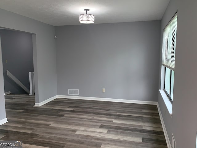 3261 Harbor Woods Rd, Decatur, GA 30034 - spare room with baseboards, dark wood finished floors, and visible vents