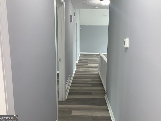 3261 Harbor Woods Rd, Decatur, GA 30034 - hall with dark wood-type flooring, a textured ceiling, baseboards, and visible vents